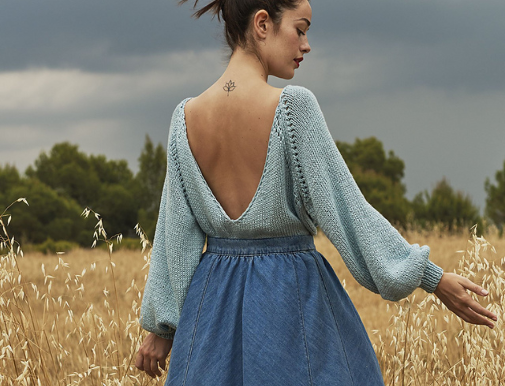 top manica lunga con schiena scoperta in maglia